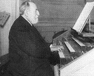 Charles Camille Saint-Saëns at the organ