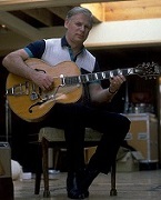 Vic Flick in 1989 with guitar - photo by Geoff Leonard