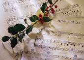 Christmas holly and sheet music for Carols