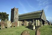 photo of a church with a cemetery in the foreground