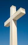 photo of a white cross against the blue sky