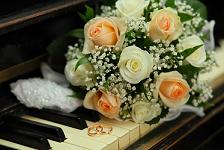 wedding bouquet resting on a piano